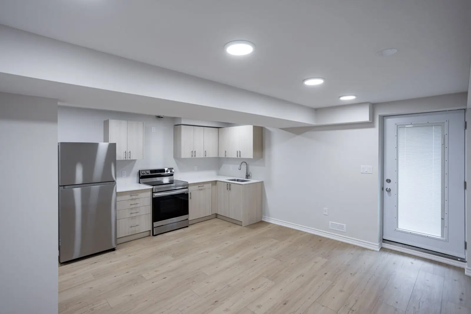 Finished legal basement apartment with kitchen and living space